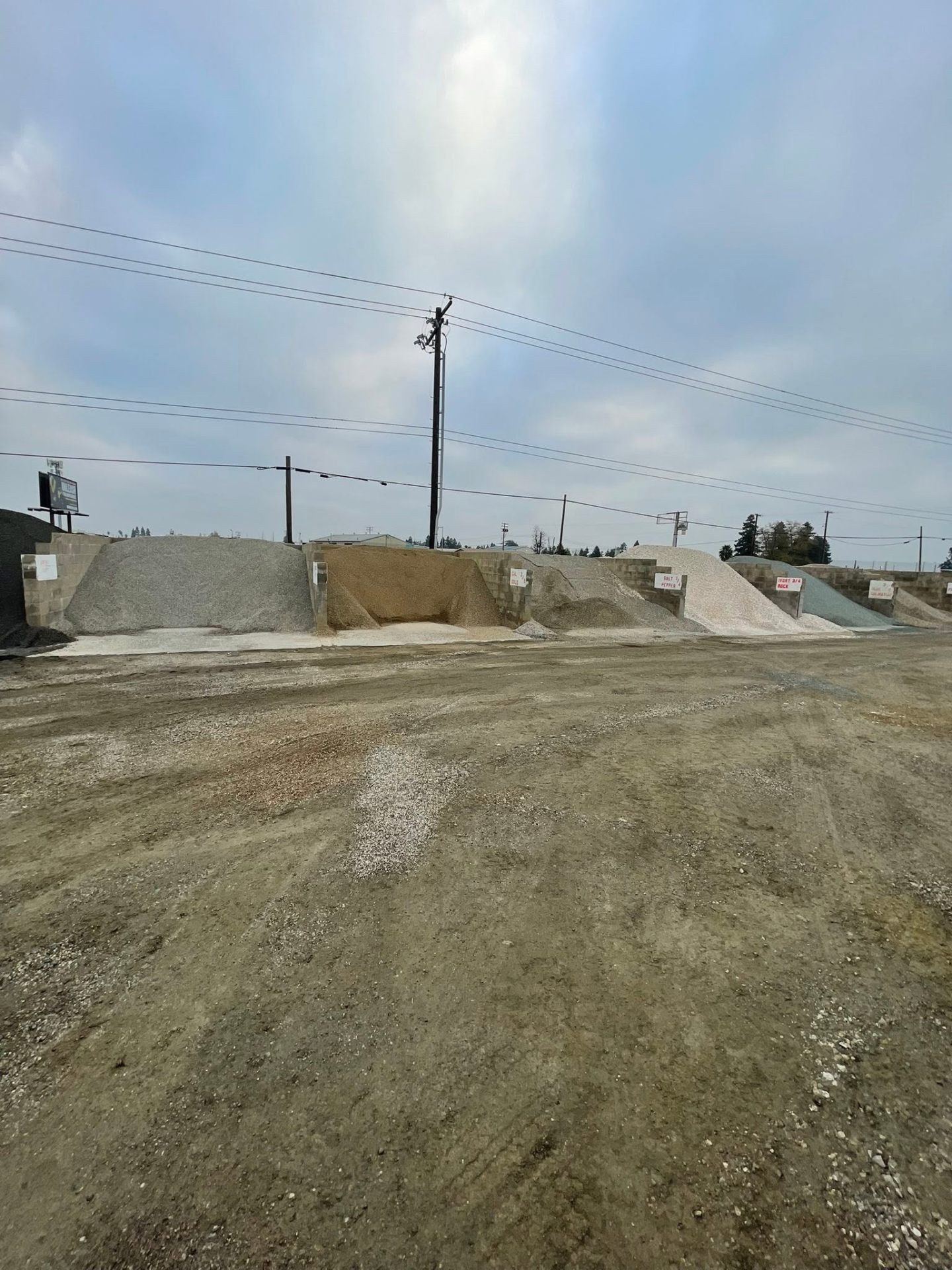 Sacramento aggregate yard with gravel, sand, and rock piles